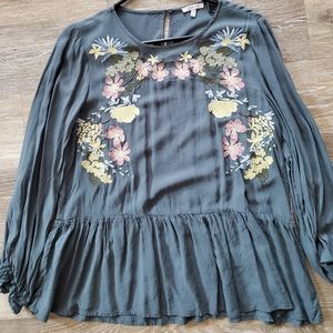 Embroidered floral ruffle bottom top